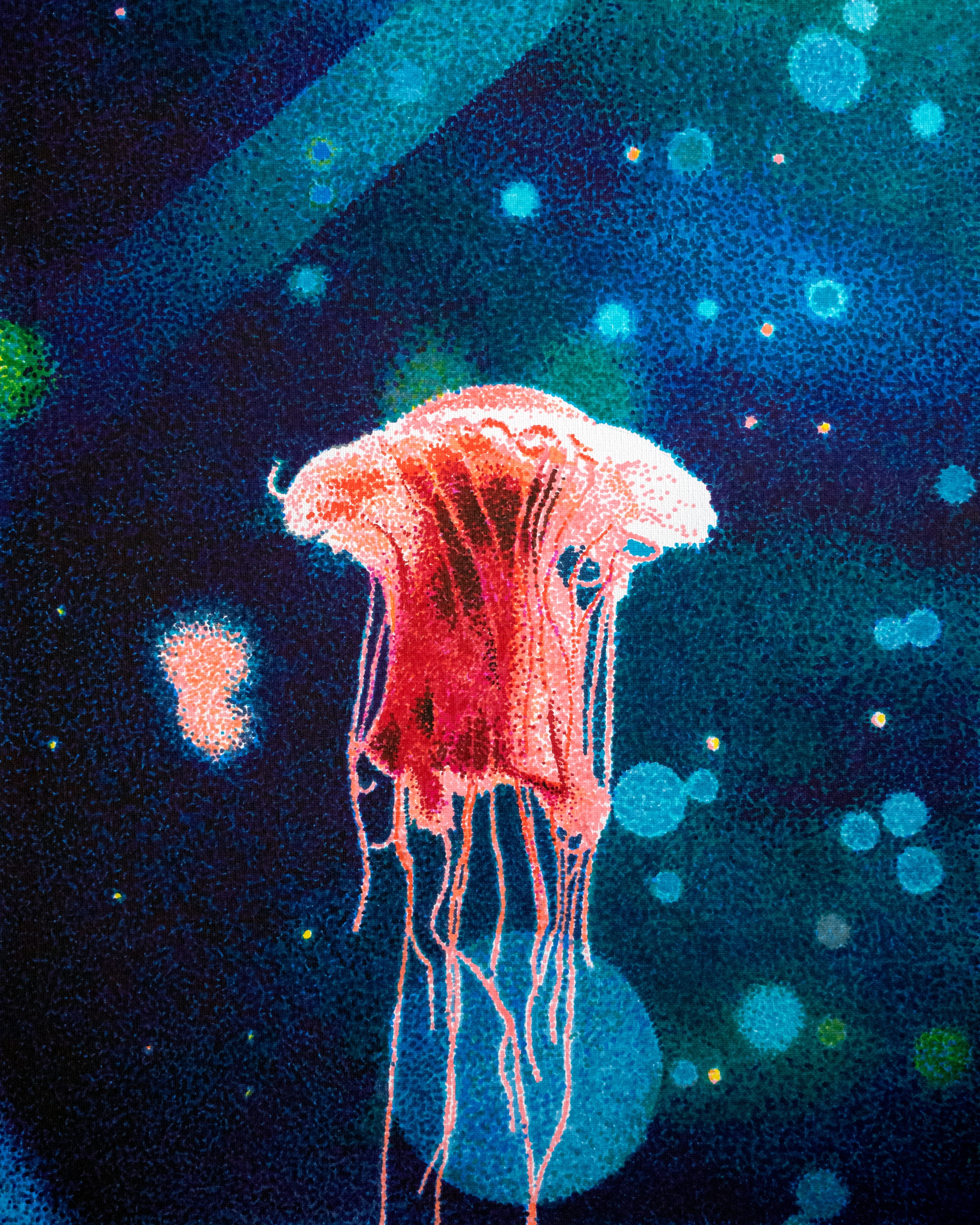 jellyfish in water with bubbles and specs in the water