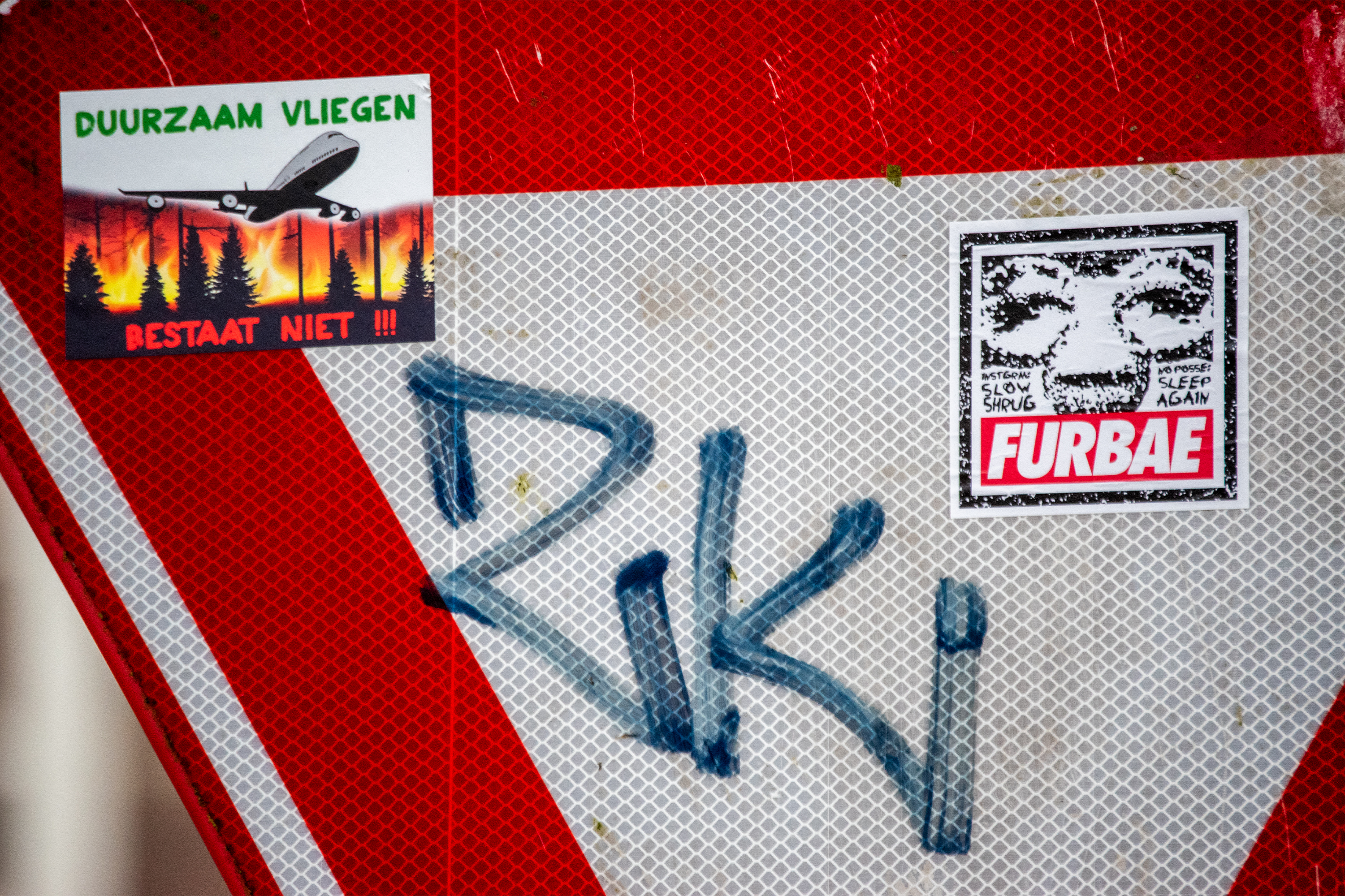 close up of graffiti on road sign