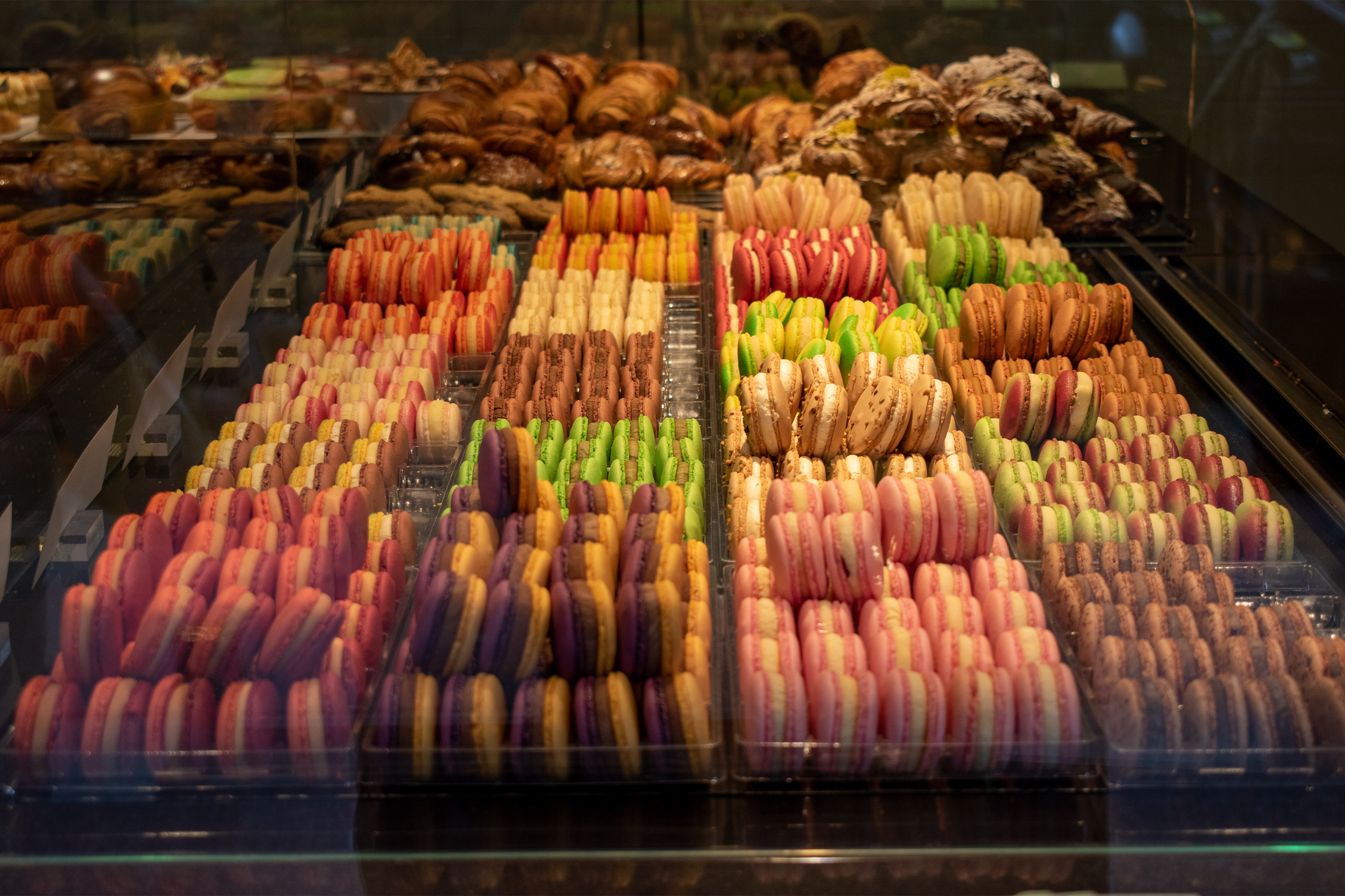 patisserie window in Amsterdam, full of macarons of all colours